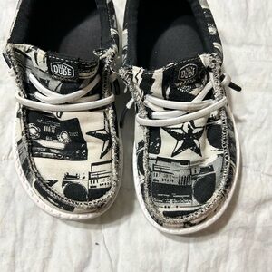 Hey Dude Black and White Sneakers with Newsprint Design